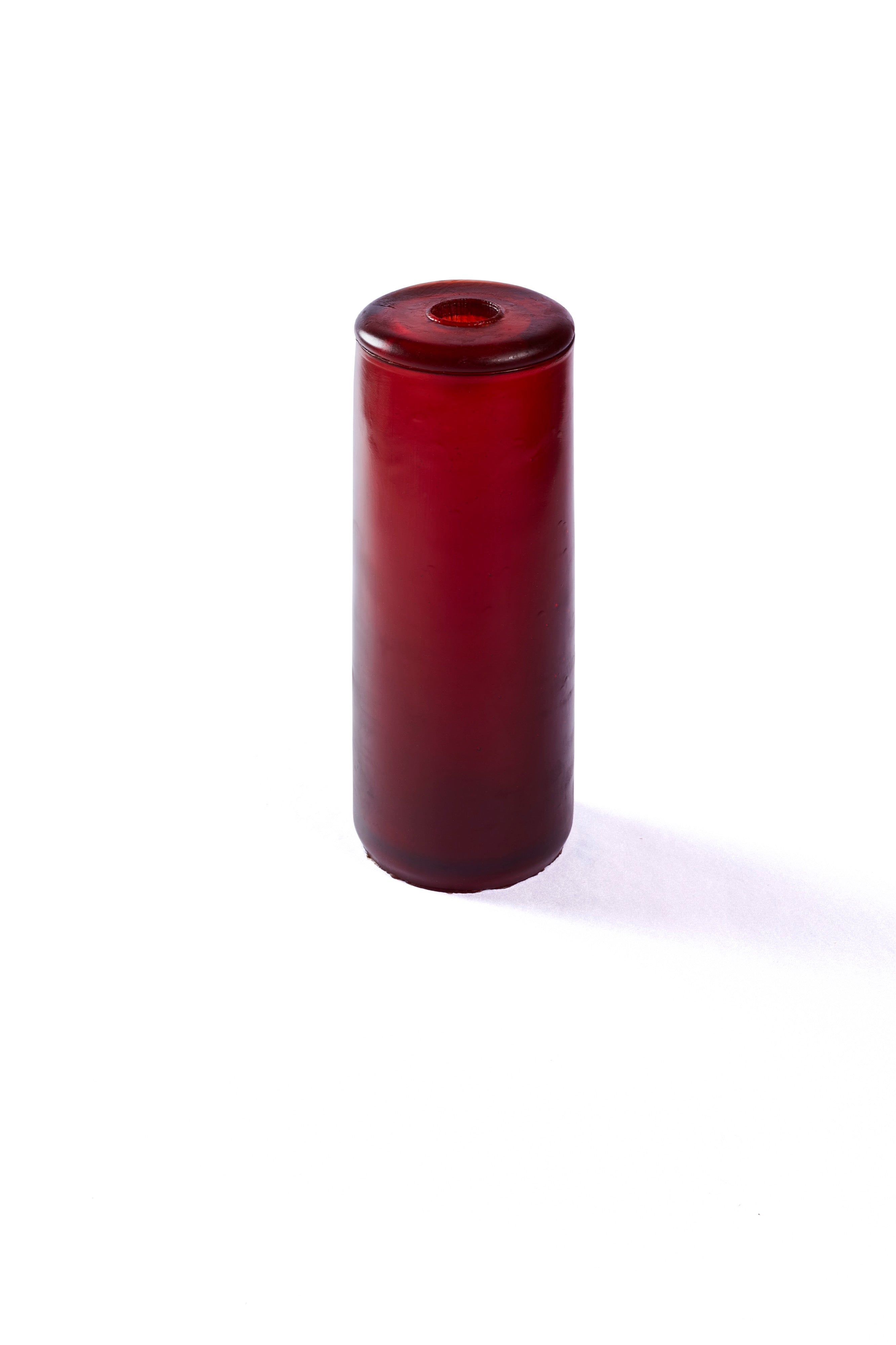 A tall rubber gleba urn in a dark rich red.